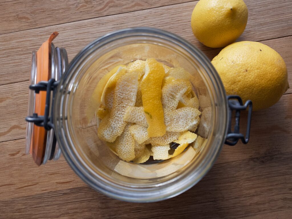 Lemon peel sitting in bottom of mason jar