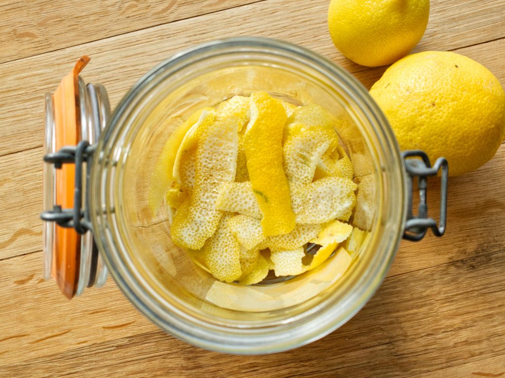Lemon peel sitting in bottom of mason jar