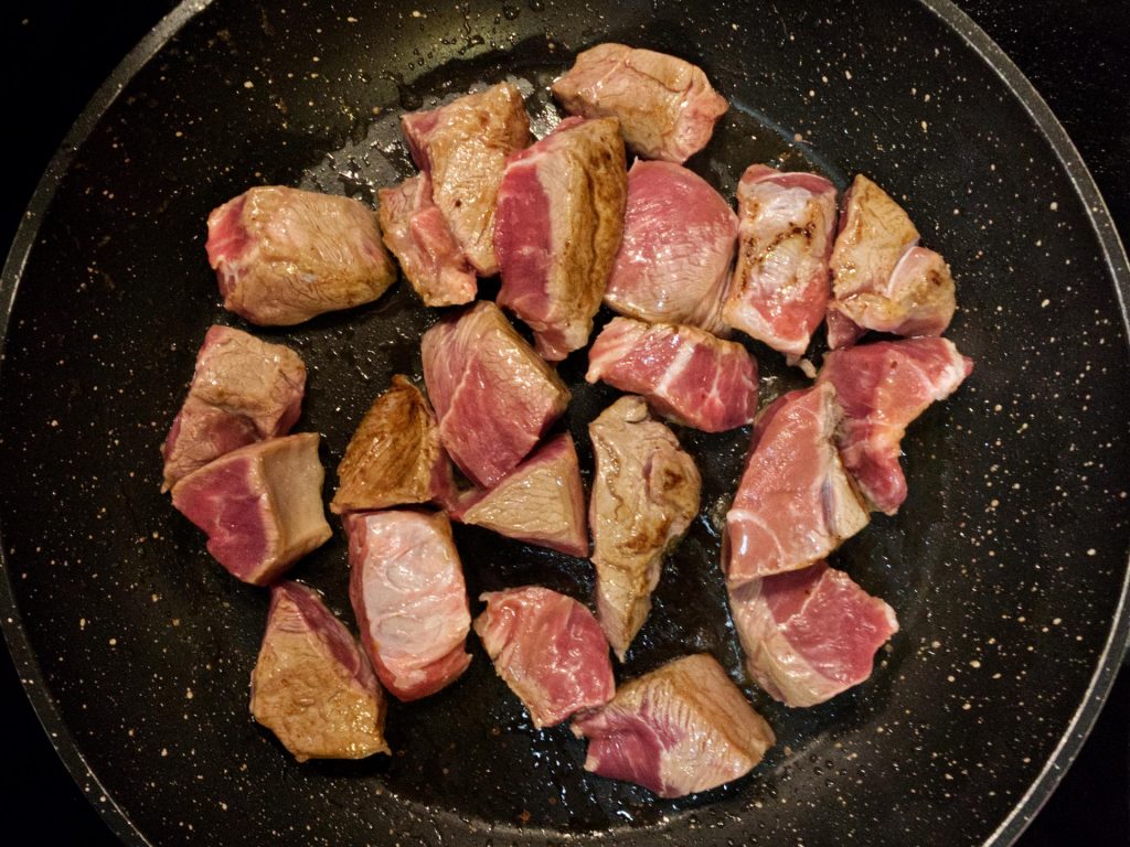 Searing beef in a frying pan