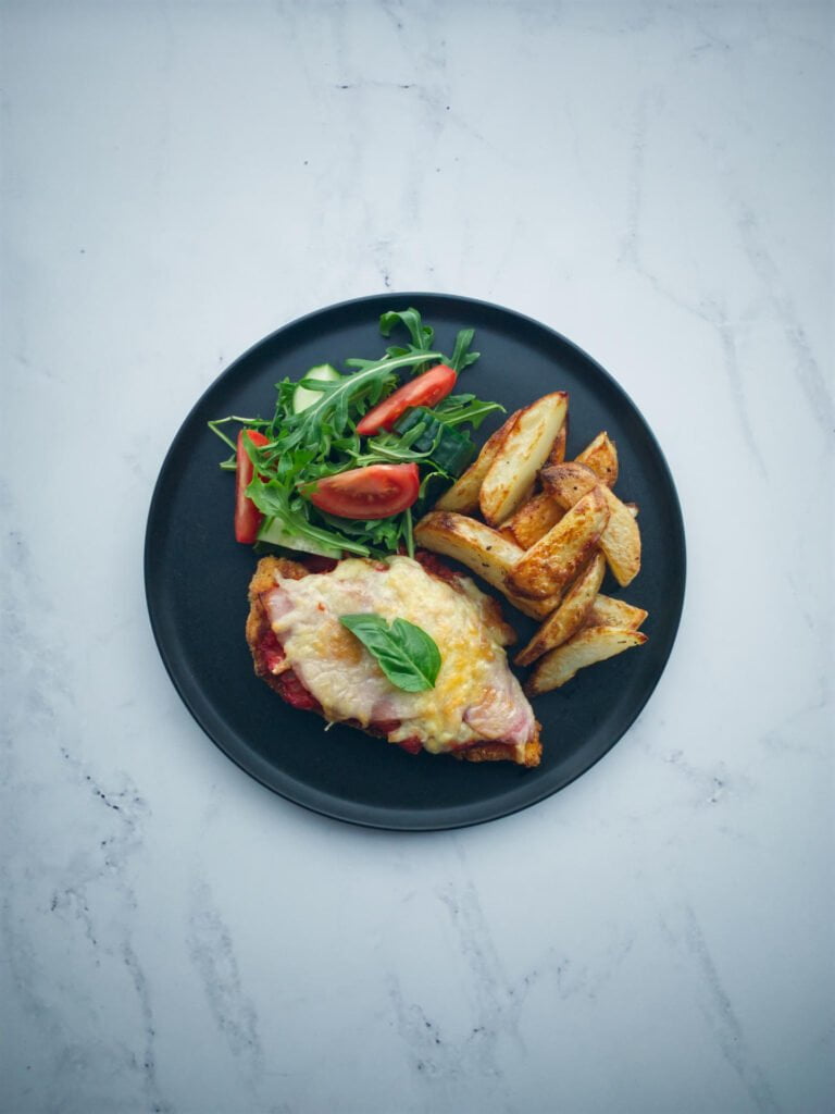 Chicken parmigiana with oven-baked chips