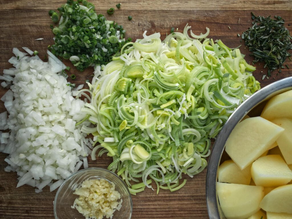 Shepherd's pie ingredients diced and chopped on a board