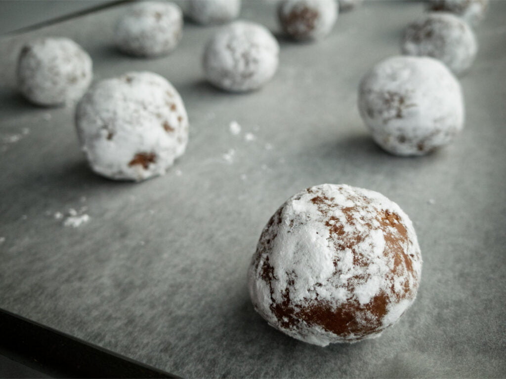 Chocolate Crackle Cookie balls on baking tray