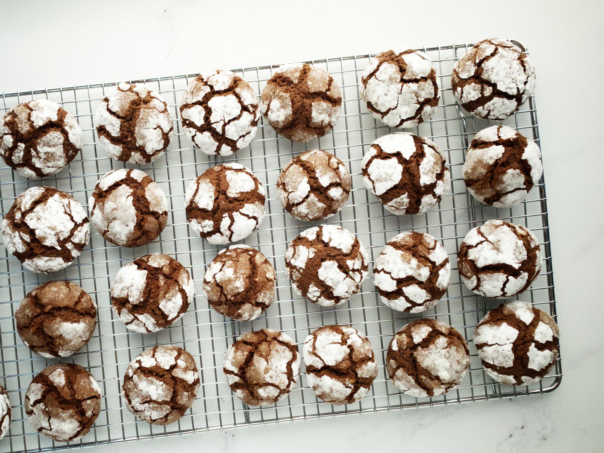 Chocolate Crackle Cookies on wire rack