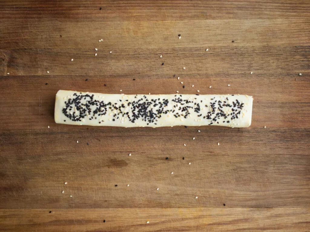 Beef sausage roll strip before being divided into individual servings