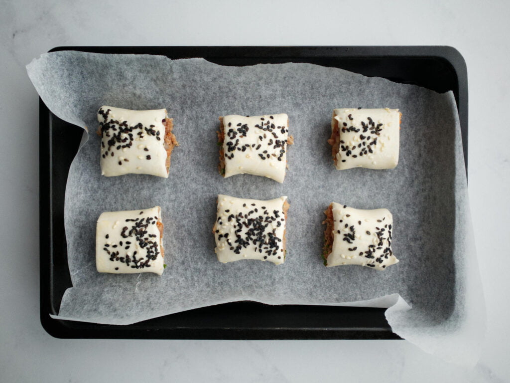 Beef sausage rolls in baking tray