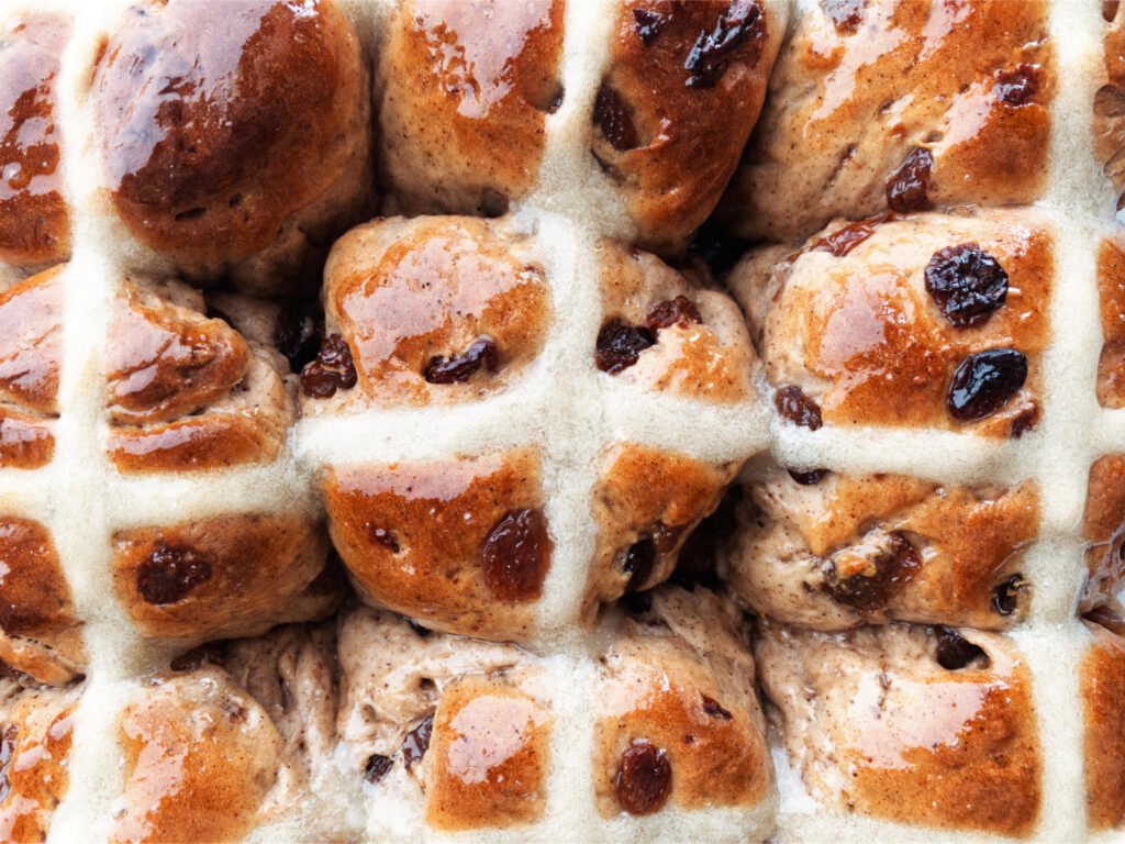 Freshly glazed hot cross buns