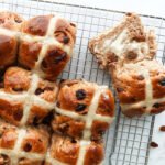 Delicious hot cross buns with lashings of butter