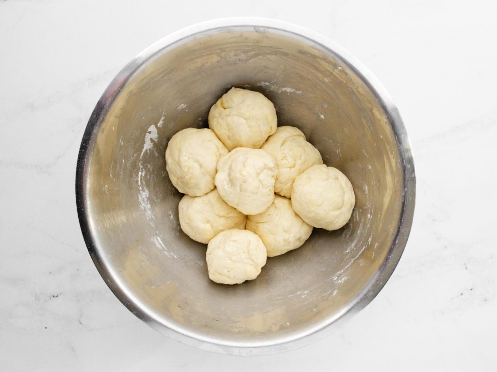 Flatbread dough divided into 8 portions.